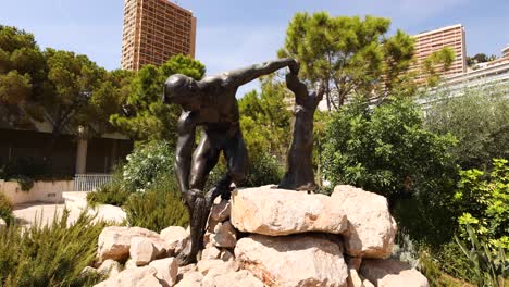 bronze statue in lush park setting