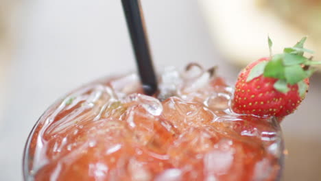 close-up of a refreshing strawberry drink with ice