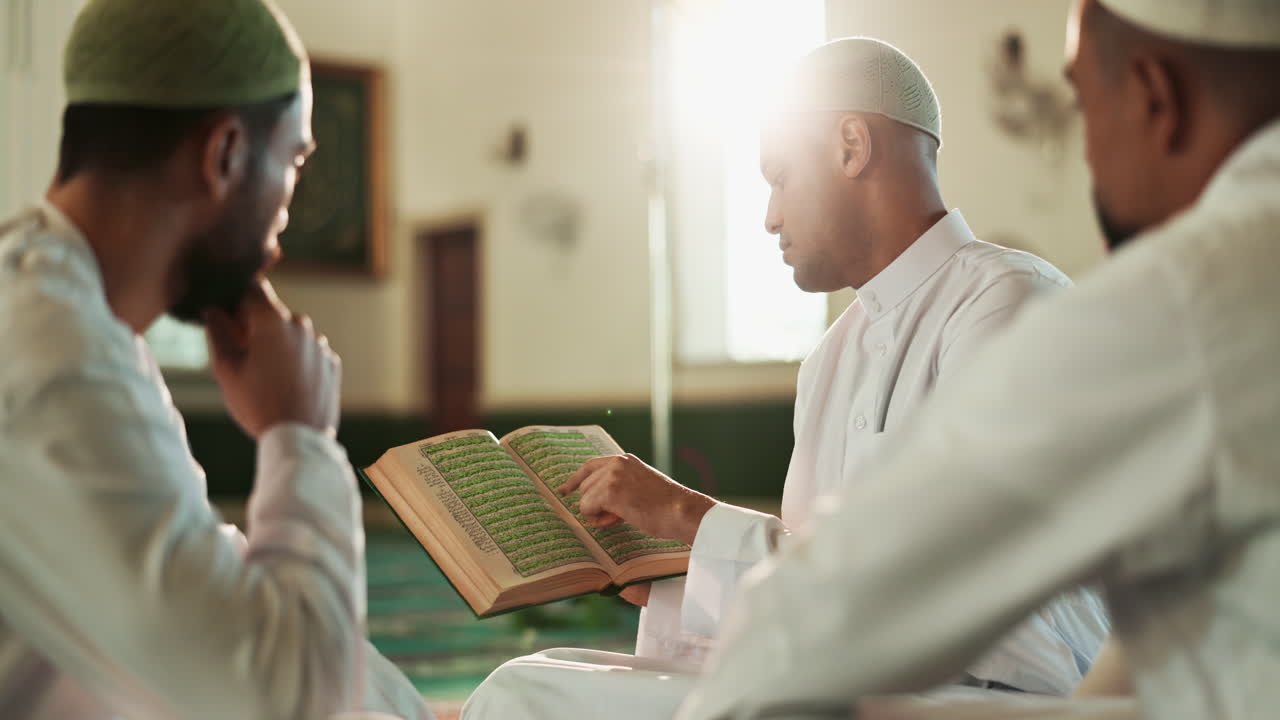 Muslim men reading the Koran in a mosque