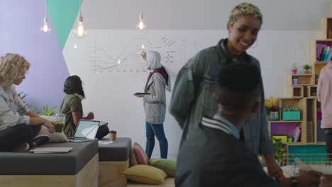 young multi ethnic business people brainstorming students collaborating discussing creative ideas working together in busy diverse office sharing communication enjoying teamwork