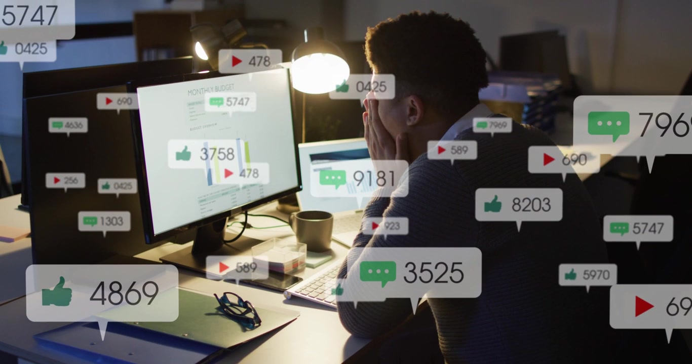 Male analyst analyzing finance charts on monitor while notifications multiplying, covering eyes