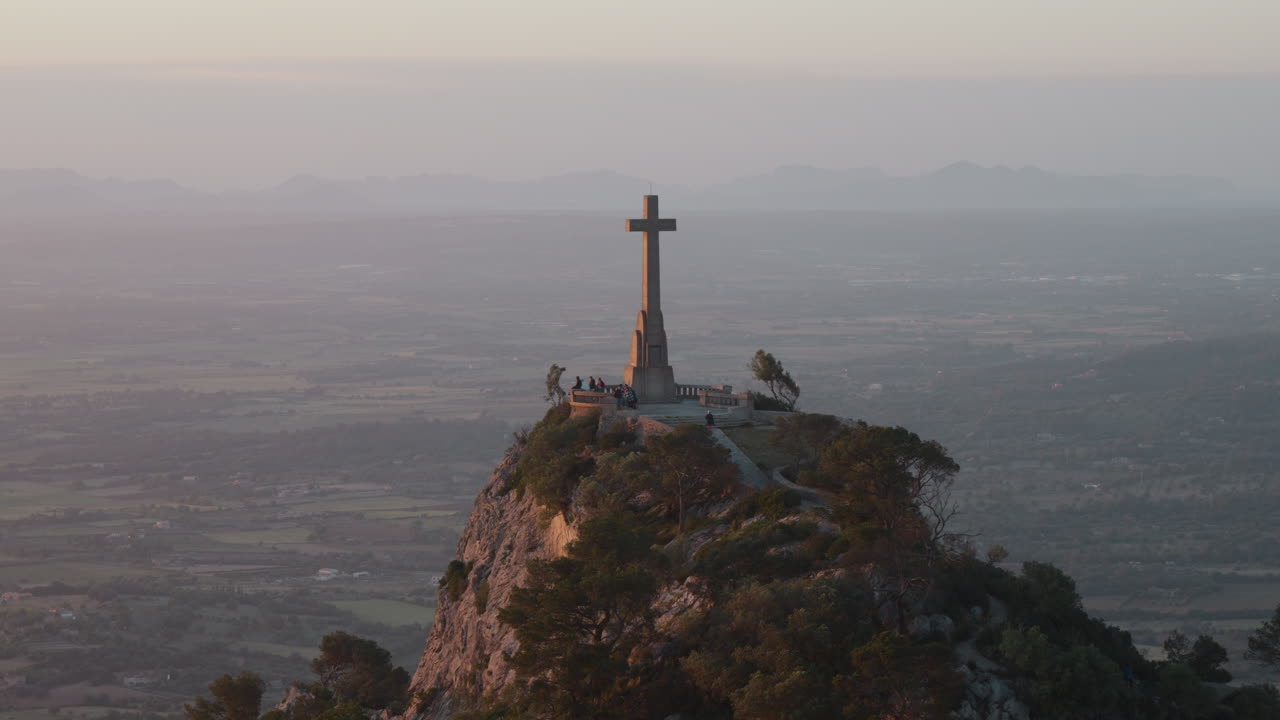 Majestic view from Sant Salvador mountain in Mallorca at sunset. Ideal for travel documentaries and serene promotional content.