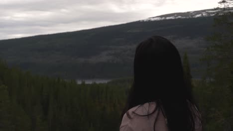 girl looking into the horizon from high grounds