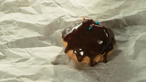 closeup pastry decorating with multicoloured confectionery in slow motion.