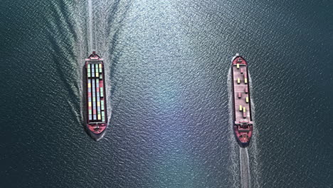 aerial view of two container ships sailing on the ocean