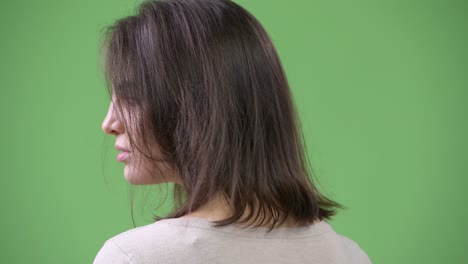 young beautiful woman looking back
