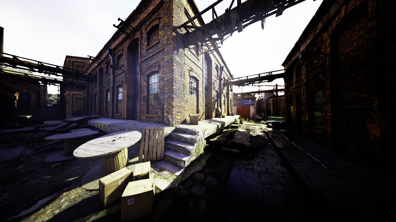 Old industrial area with abandoned buildings and scattered debris near evening