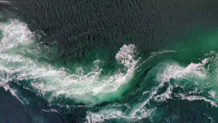 Waves of water of the river and the sea meet each other during high tide and low tide.