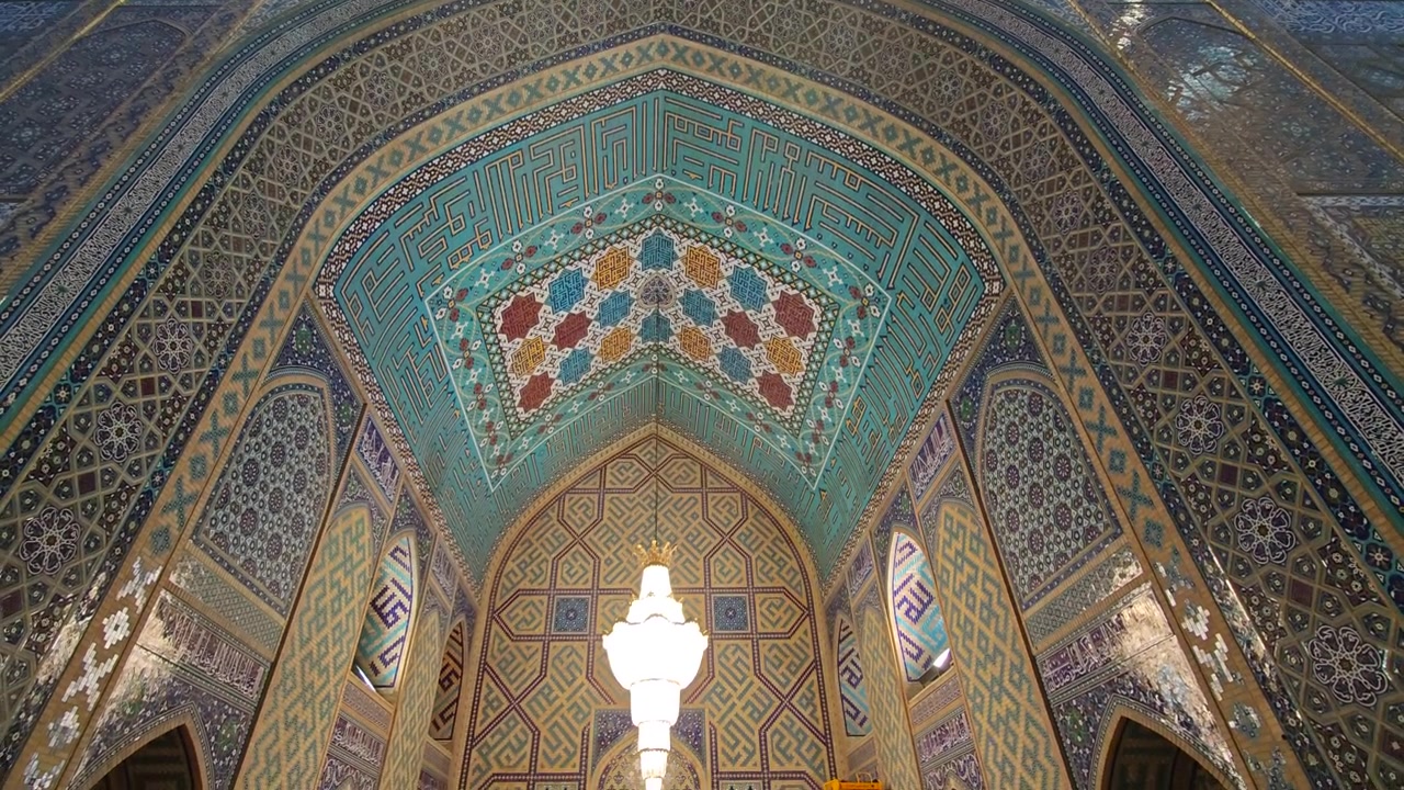 Intricate Tiled Archway and Chandelier Inside a Traditional Mosque