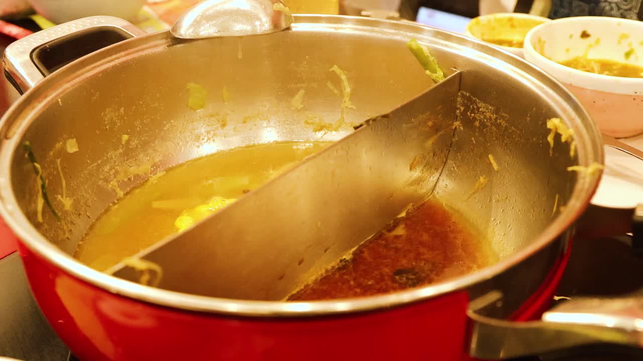 Simmering hotpot soup in a shared dining experience
