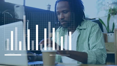 animation of statistical data processing over african american man using laptop at a cafe