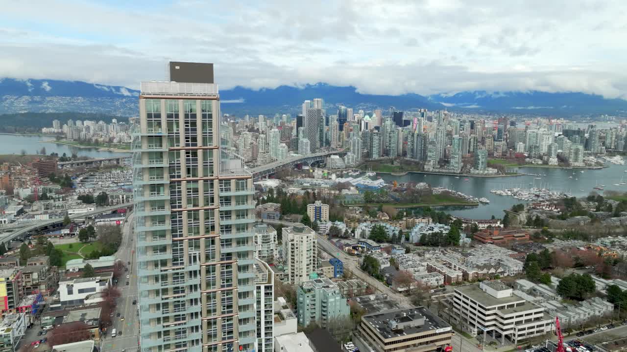 Broadway and Granville, Vancouver, Canada – Urban Cityscape Showcasing Dense High-Rise Buildings, Commercial Activity, and Bridge Access – Aerial Drone Shot
