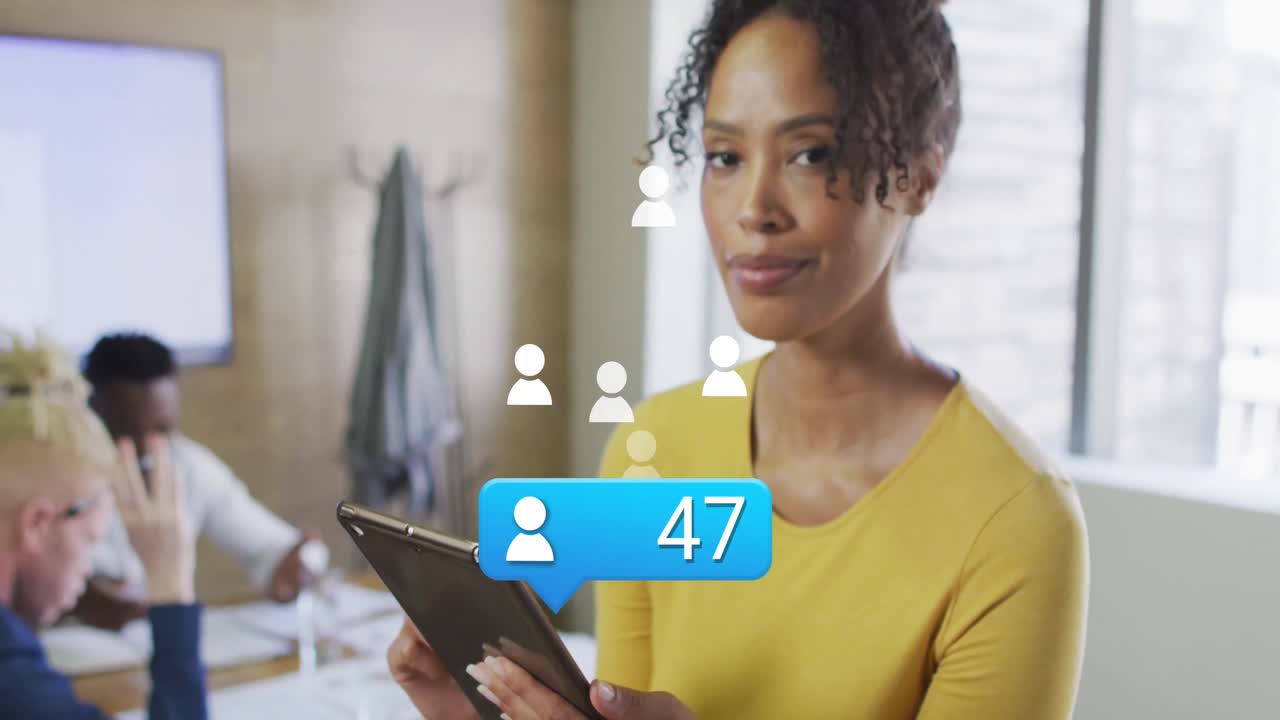 Animation of icons and data processing over african american businesswoman in office