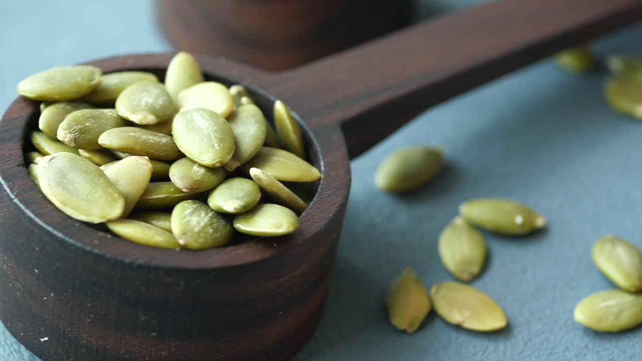 Pumpkin Seeds in Wooden Scoop