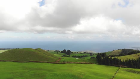 agriculture fields, rural landscape with atlantic ocean in background, azores