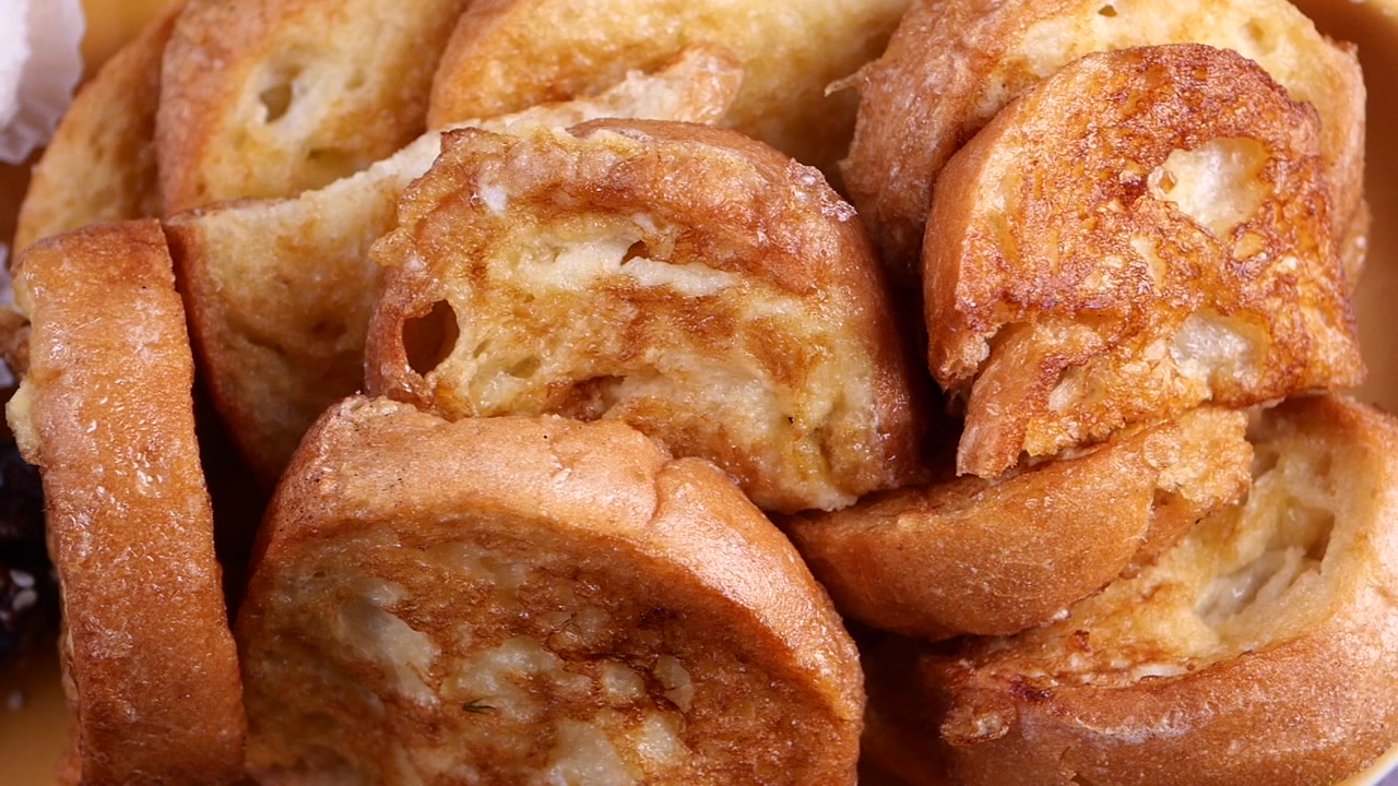Close-up of Golden Brown French Toast Slices in a Bowl