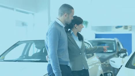 animation of multiple white arrows going down over caucasian couple standing by a car