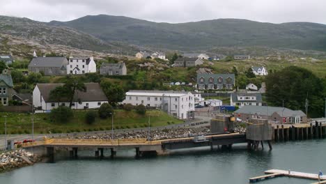 a shot of the village of tarbert with the ferry dock in the foreground