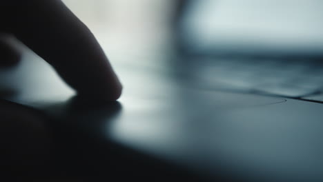 hand using laptop touchpad
