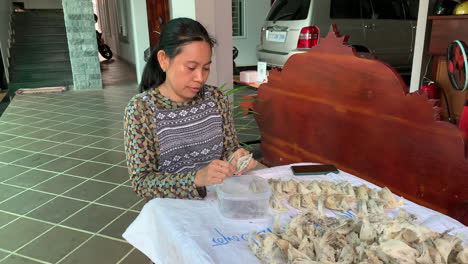 woman cleaning and preparing edible bird nests