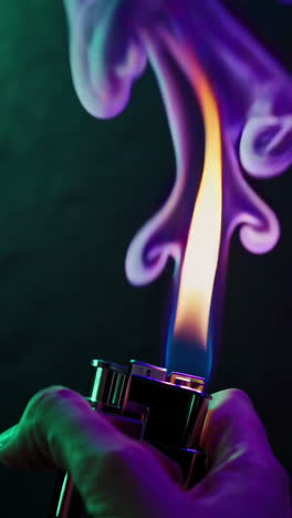 close-up of a lighter with colorful flame and smoke