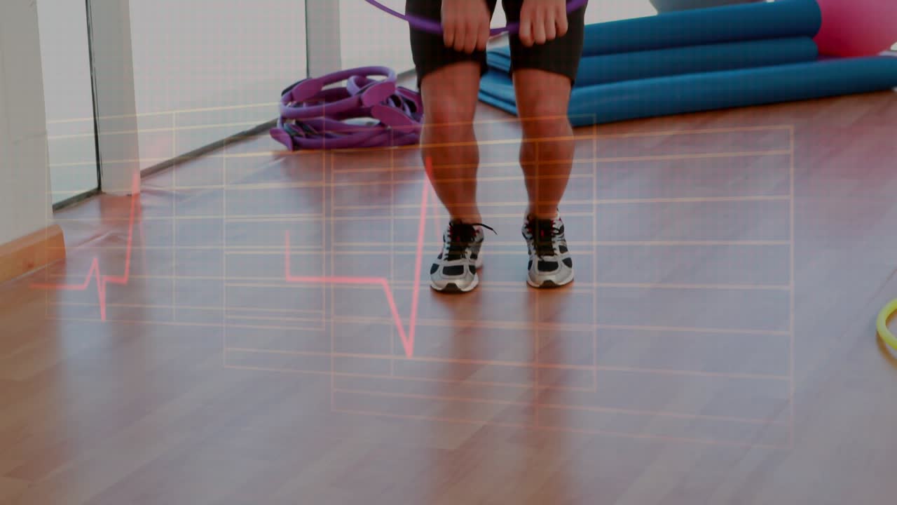 Man performing hoop cardio in gym, small jumps starting hoop rotation and animating ECG overlay