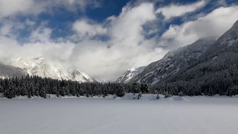 Overcast-Over-Frozen-Gold-Creek-Pond-With-Snowcapped-Cascade-Range-In-Background-In-Washington,-United-States