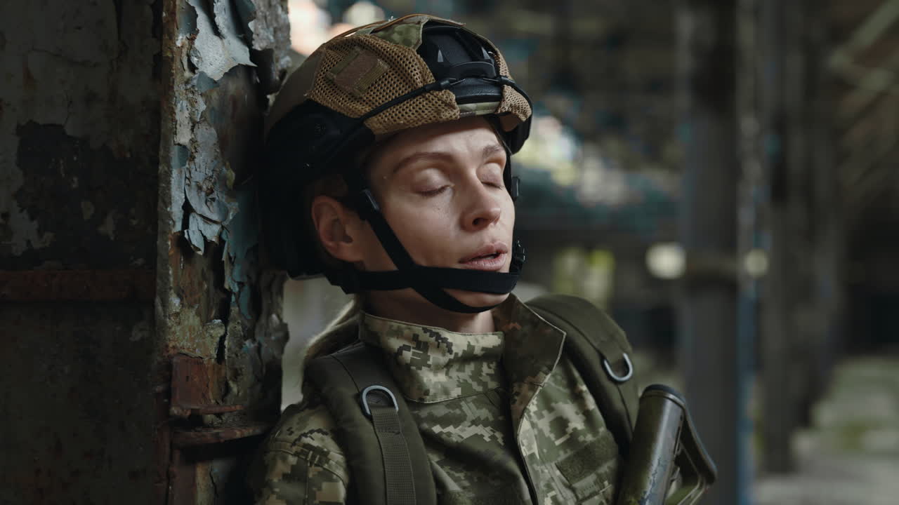 Tired Soldier Resting in a Ruined Industrial Site