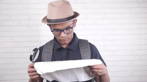 young person studying a map