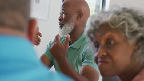 Happy-senior-diverse-people-having-breakfast-at-retirement-home