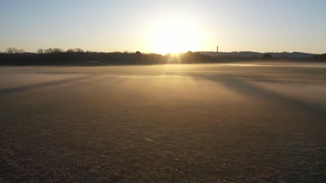 sunrise over foggy farmland