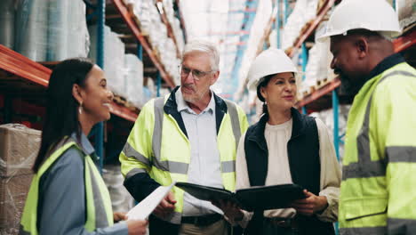 warehouse workers discussing logistics and inventory management
