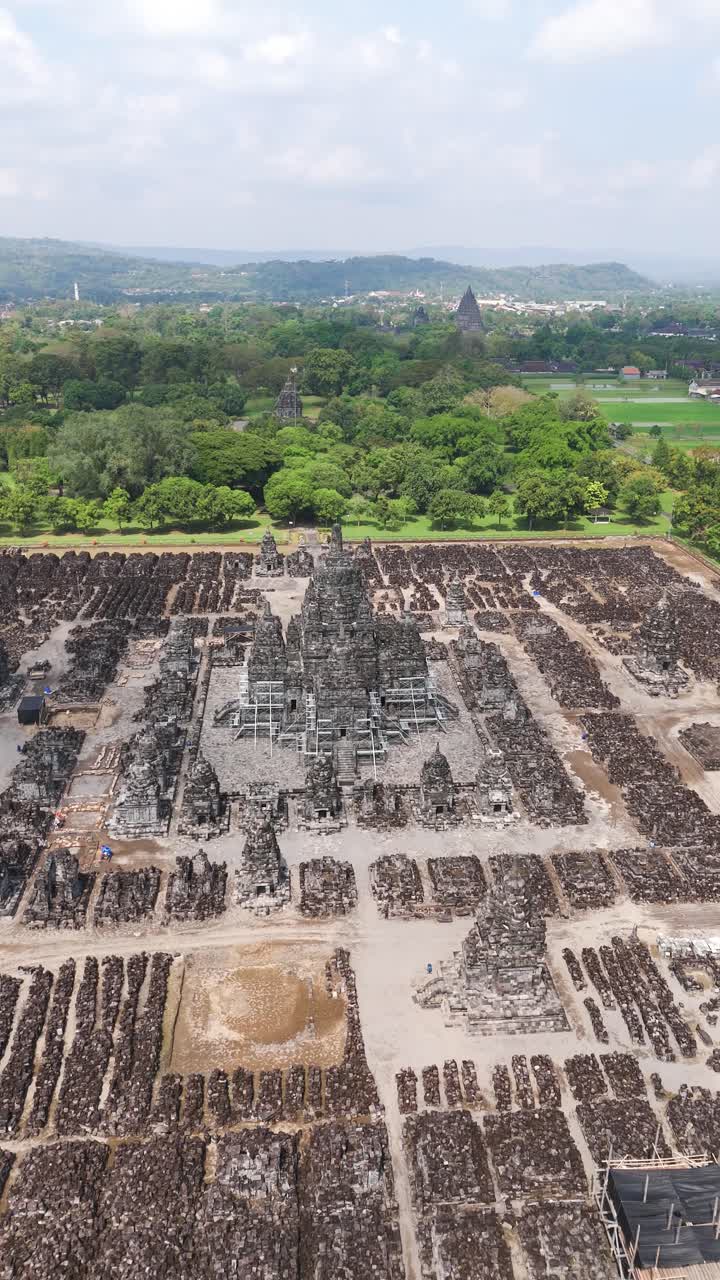 Sewu Temple, historic 8th-century Buddhist complex near Prambanan in Yogyakarta, Indonesia, showing ancient stone structures and temple ruins, aerial vertical view