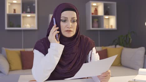 frustrated business woman in hijab. home office.