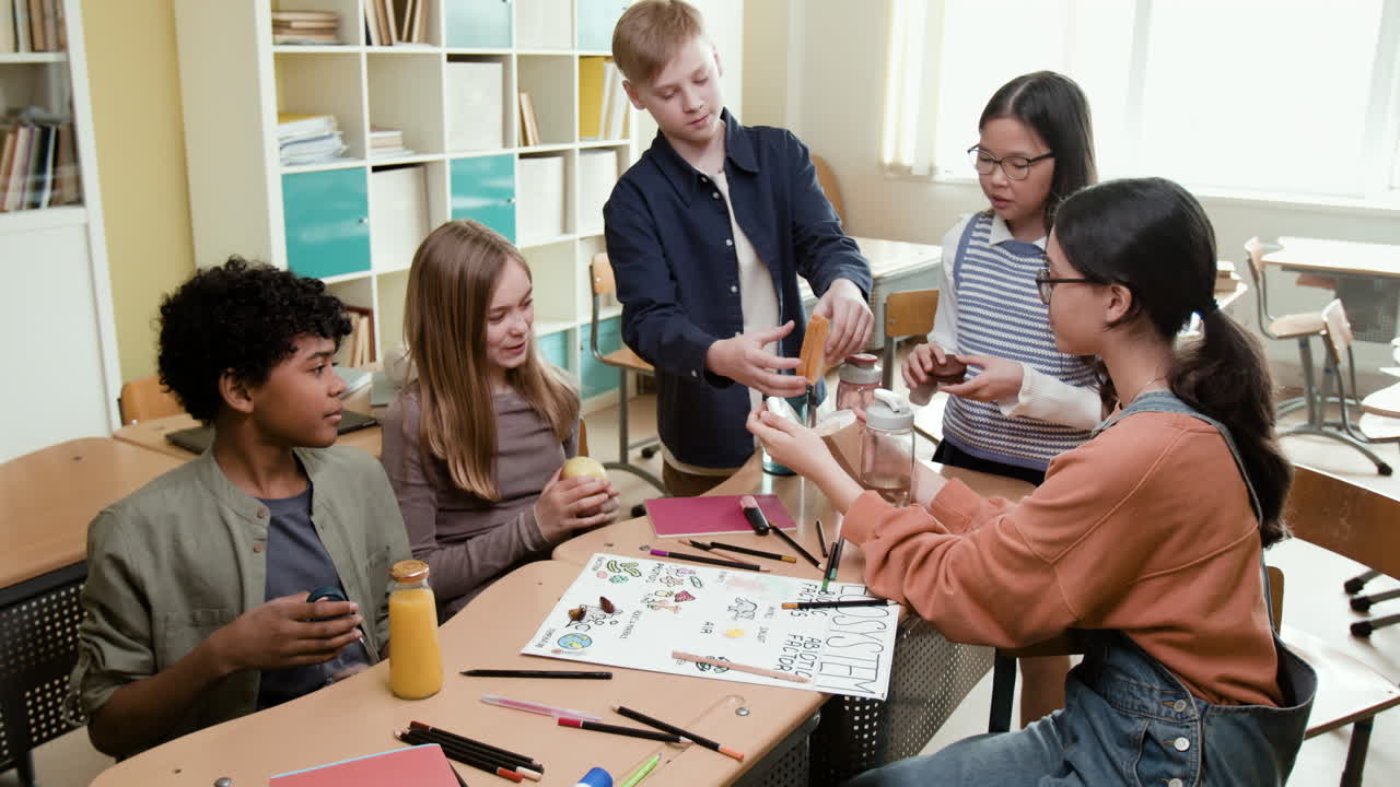 Students collaborating and sharing snacks in a classroom