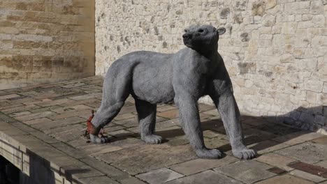 chained statue of bear in the tower of london, side view