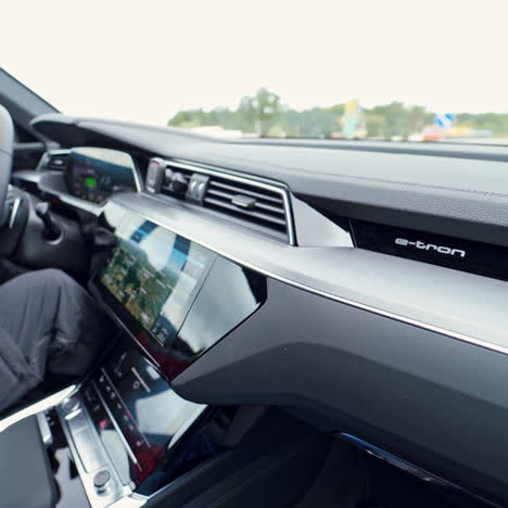 vinnitsa, ukraine - september 2019: suv audi e-tron. interior detail view with controls and steering wheel.
