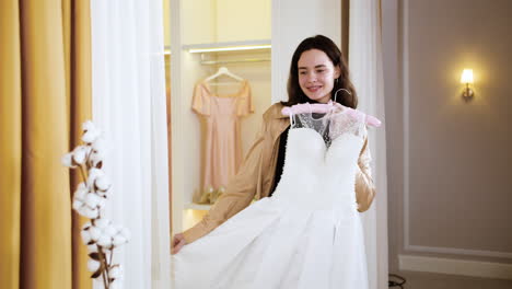 caucasian woman in wedding dress shop