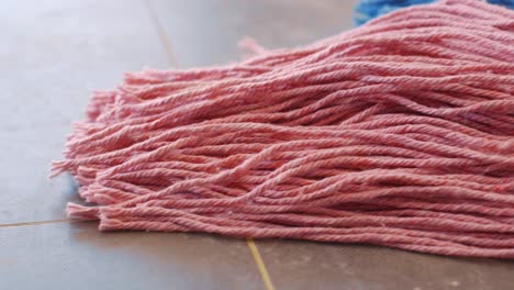 new pink and blue mops ready for cleaning - close up