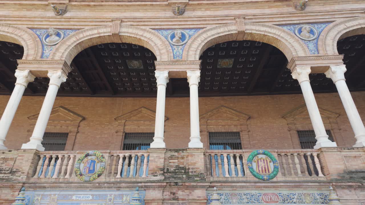 Detailed ceramic tiles and brick facade at Plaza de España Seville Spain