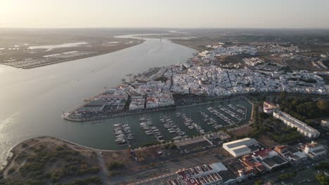 aerial forward view of coastal town of ayamonte with its marina