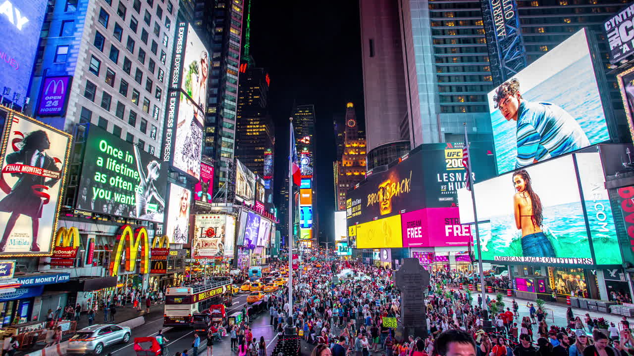Times Square at Night: A Bustling Urban Spectacle with Bright Billboards and Crowds