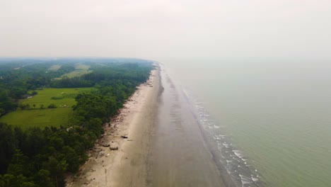 aerial view of kuakata sea beach with jhau forest for natural embankment in bangladesh