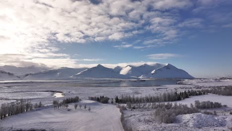 snowy mountains and scenic landscape with vast open space, shot from a drone in borgarfjörður, iceland