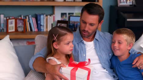 father giving present to daughter