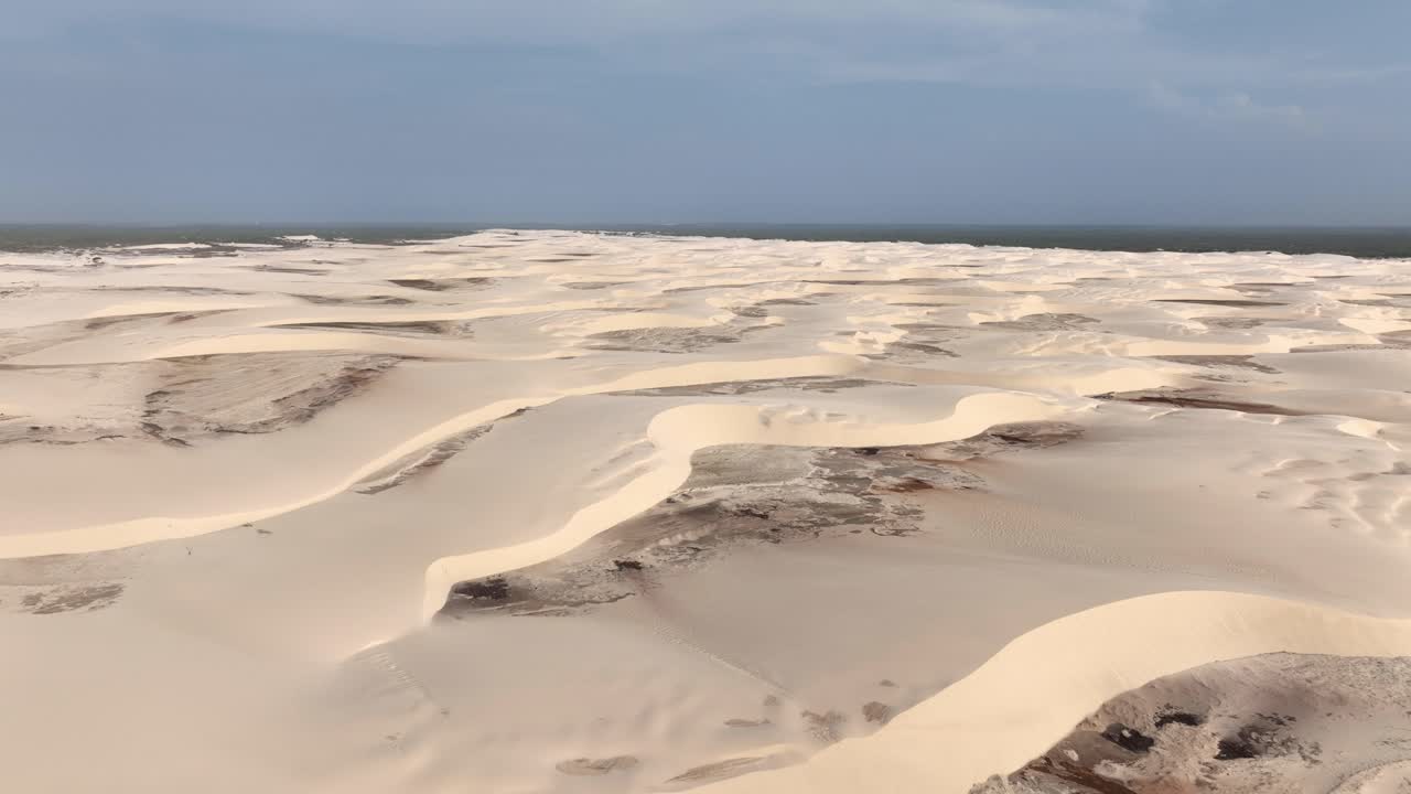 Arid Sand Dunes Of Lencois Maranhenses National Park In Maranhao, Brazil. wide aerial shot