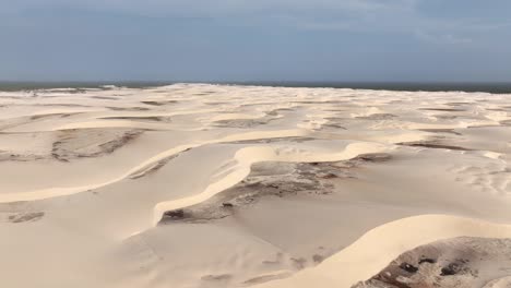 arid sand dunes of lencois maranhenses national park in maranhao, brazil. wide aerial shot