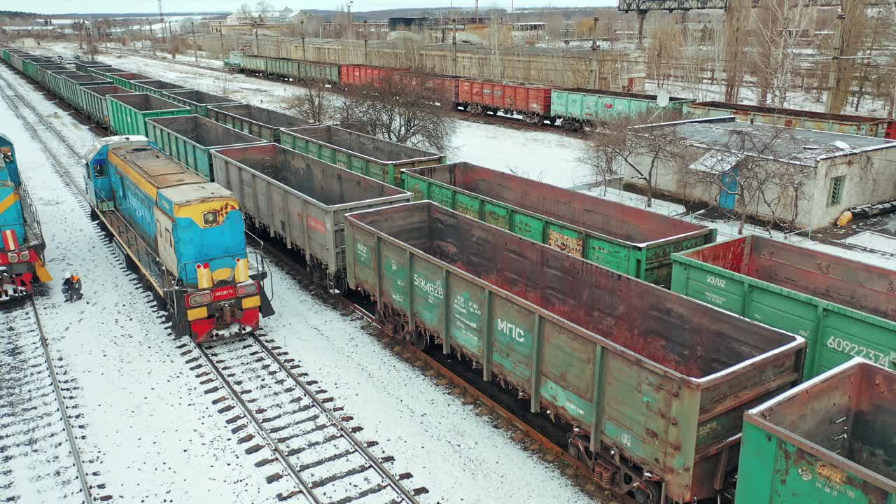 Cargo Trains And Containers At Terminal. Long railway freight trains with lots of wagons, aerial view