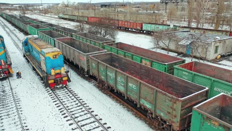 cargo trains and containers at terminal. long railway freight trains with lots of wagons, aerial view