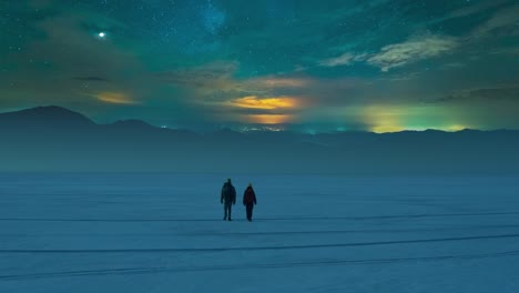 the two travelers walking through the night snow field